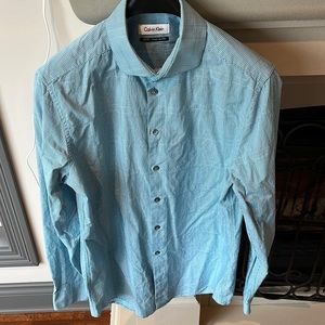 Never worn slim fit Calvin Klein light blue dress shirt